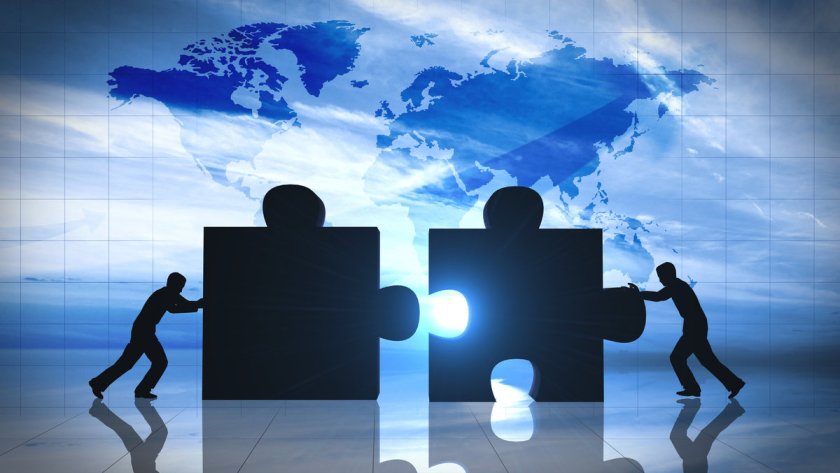 World Business teamwork puzzle pieces